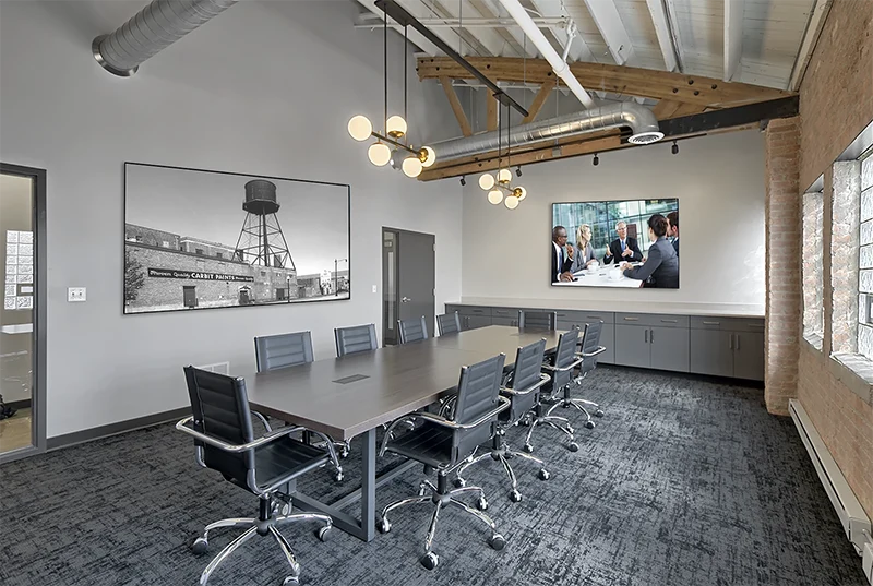 conference room with dark chars and carpet