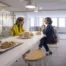Hybrid workplace breakroom with flexible seating and lounge areas