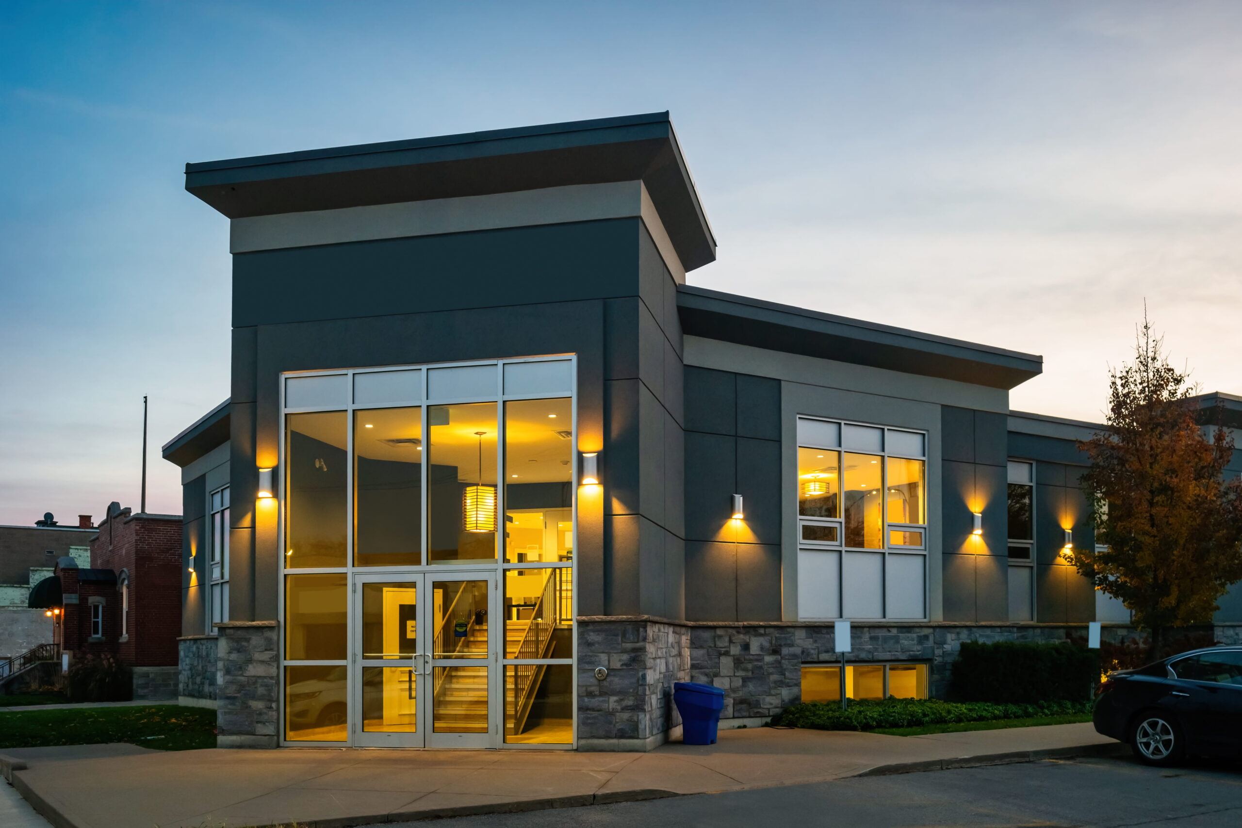 Small office building illuminated at night