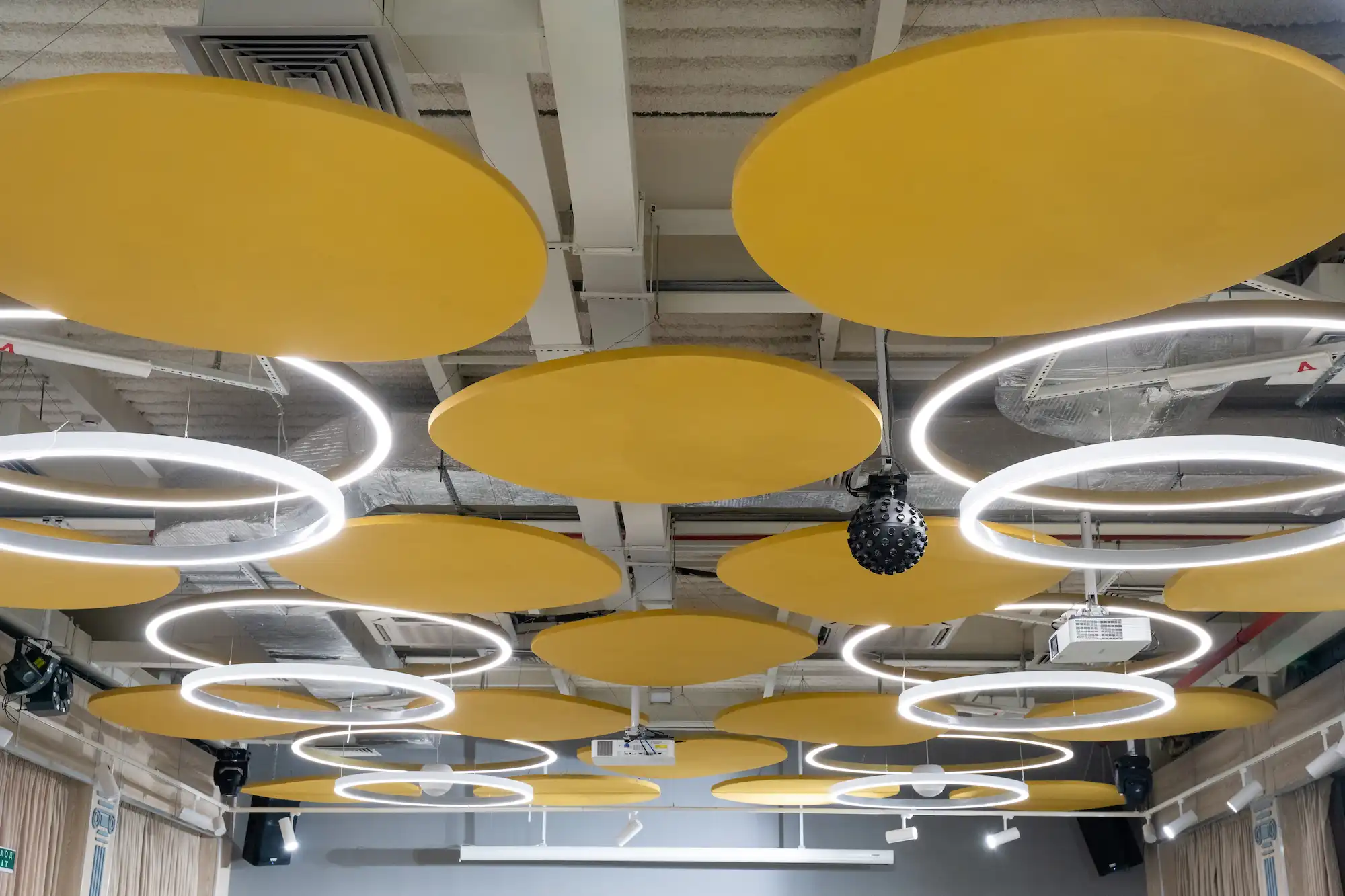 Modern commercial office ceiling with acoustic cloud panels