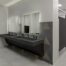 Touchless restroom technology in a modern commercial bathroom