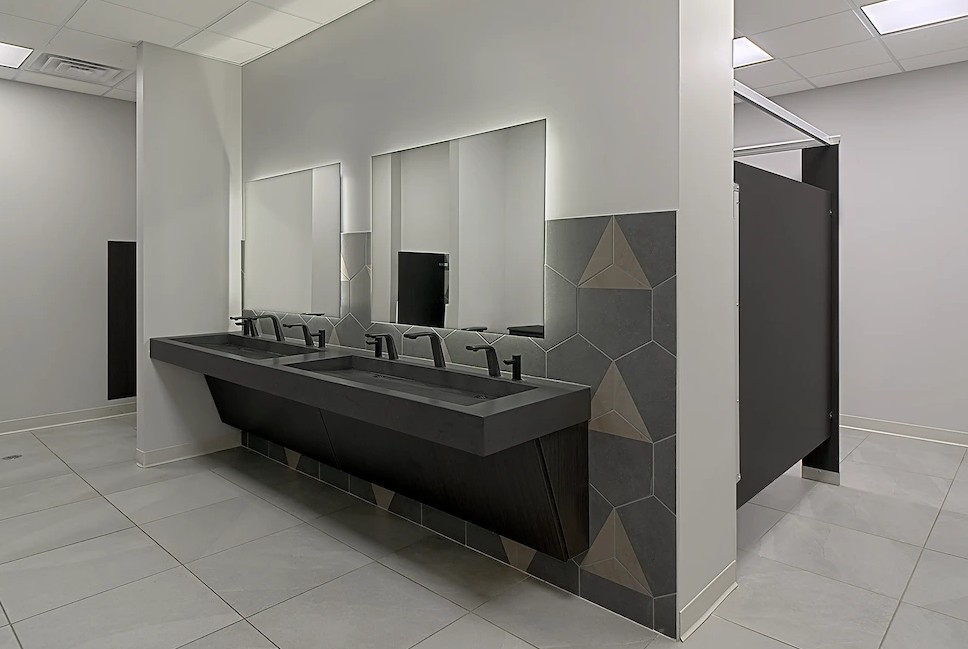 Touchless restroom technology in a modern commercial bathroom