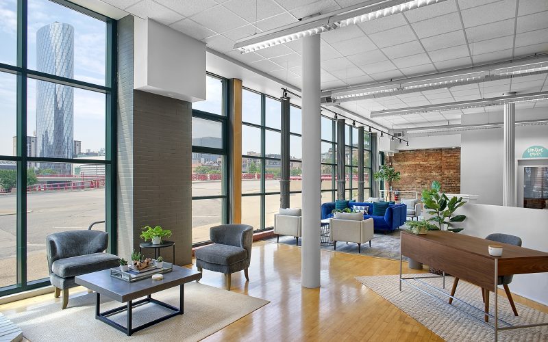 a modern office lobby with bright light streaming in