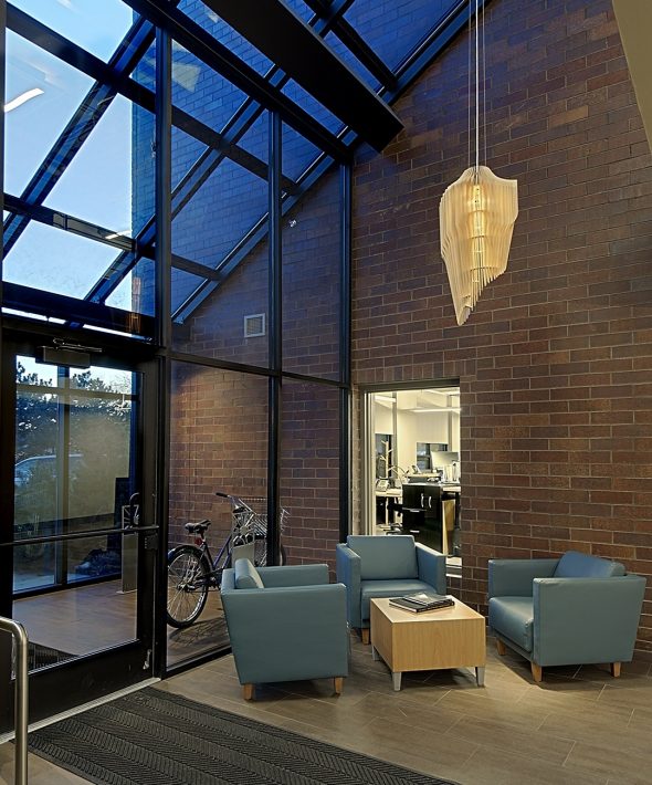 an office lobby with beautiful windows